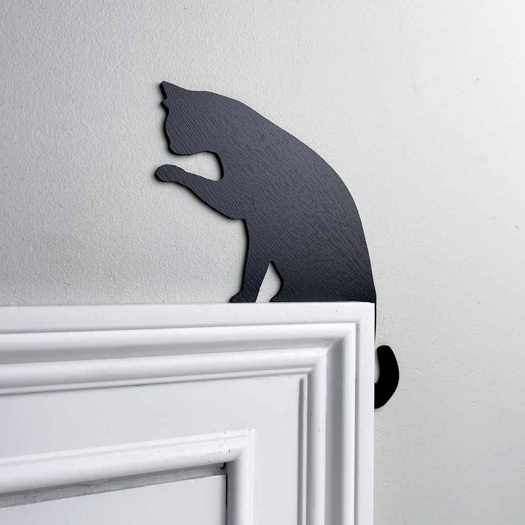 Cat Licking Paw Door Topper