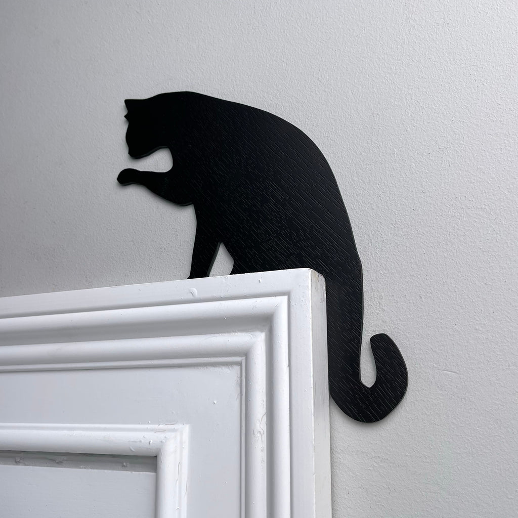Cat Licking Paw Door Topper