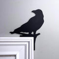 Head Turning Crow Door Topper